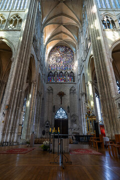 Exploring the interior of Cathedral of Amiens, known for its Gothic architecture and stained glass windows in France