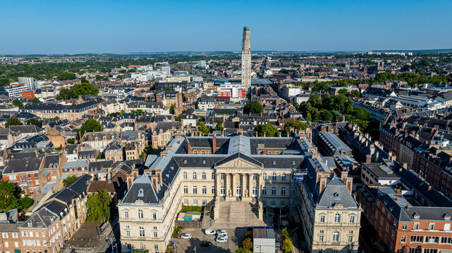 Cathedral of Amiens stands tall in the cityscape of Amiens during a clear day in France with views of surrounding buildings and landscape