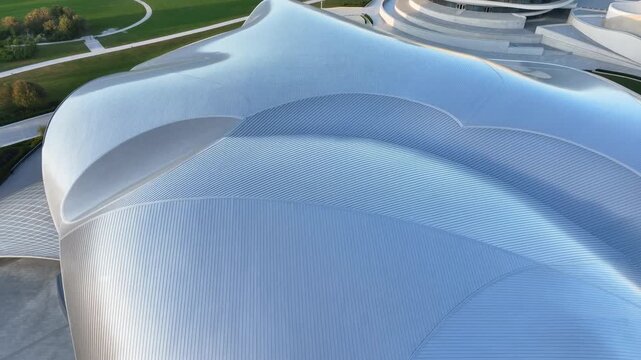 Detailed Aerial Perspective Of Futuristic Building With Lush Parklands And Complex Pathways