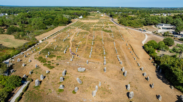 Explore the ancient megaliths at the Allignments of Menec in Carnac, Brittany, France from an aerial view capturing the historical landscape