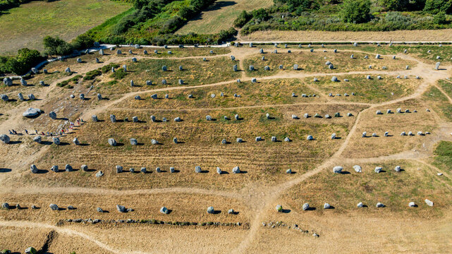 Exploration of Menec megaliths in Carnac, France shows ancient stone structures arranged in lines