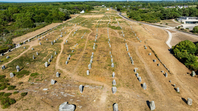 Explore megaliths at Menec site in Carnac, known for ancient stone alignments in Brittany, France