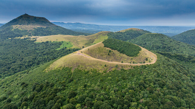 Aerial view of volcanic domes in Chaine de Puys, showcasing geological formations in central France&rsquo;s natural landscape