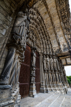Exploration of the intricate sculptures at the entrance of the cathedral in Chartres, France