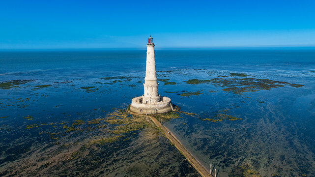 Lighthouse of Cordouan overlooks the sea and tidal flats during low tide in France
