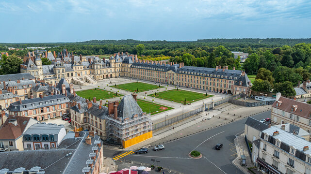 Exploring the historical architecture of Fontainebleau Palace in France at midday