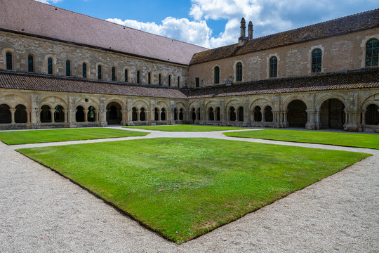 Visit to Abbey of Fontenay with its green courtyard and historical architecture in France