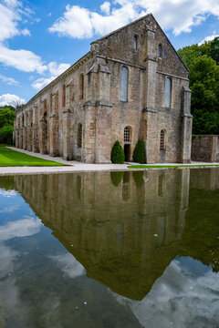 Exploring the architecture and history of the Abbey of Fontenay in France during a sunny day