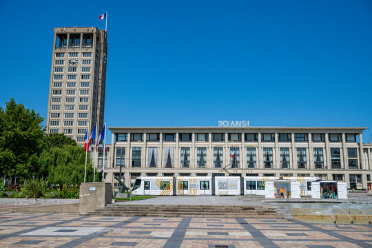 City hall building in Le Havre with flags and architecture under clear sky