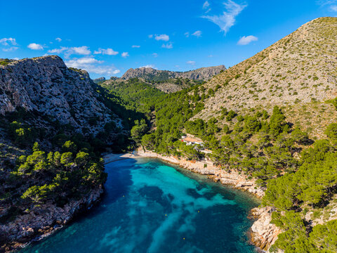 Beautiful aerial view of cala Murta beach showcasing clear waters and rocky terrain in Mallorca, Balearic islands in Spain