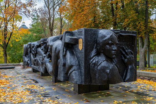 War monument in Gomel park honors memory of soldiers in Belarus with carved sculptures in autumn setting