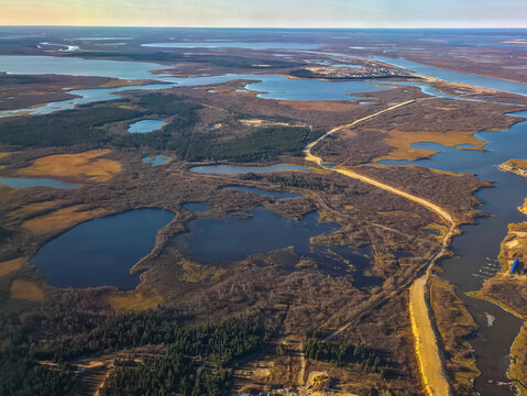 View of the Arctic landscape near Naryan-Mar revealing rivers, lakes, and forests in Nenets Autonomous Okrug, Russia during daylight
