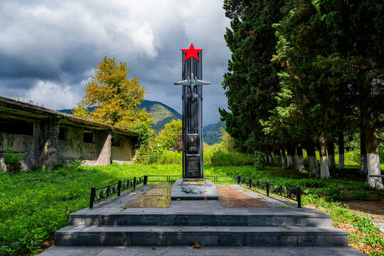 World War 2 memorial stands in Abkhazia, Russia surrounded by nature and trees marking remembrance of events from the past