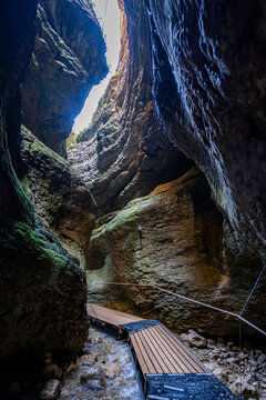 Exploring the Saltinskiy Underground Waterfall in Dagestan, Russia reveals natural rock formations and flowing water