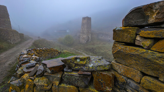 Exploring the remains of Kamunta village surrounded by fog in North Ossetia, Russia