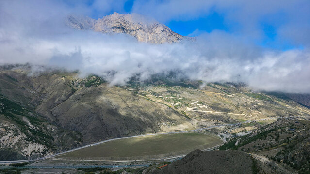 Mountain scenery with clouds and shadows in North Ossetia, Russia&rsquo;s Caucasus region during the day