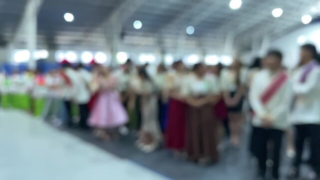 Grand entrance of the cultural dance teams dressed in native costumes during a trade fair presentation.
