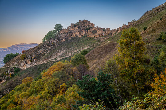 Exploring the ruins of an abandoned village in Dagestan, Russia, on a clear autumn day