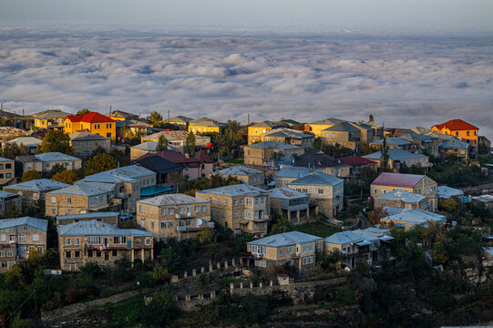 View over the houses in Kubachi town with clouds below in Dagestan Russia