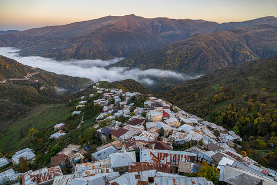 Viewpoint overlooking the Silver town of Kubachi in Dagestan, Russia during sunset with mountains and valleys in the background