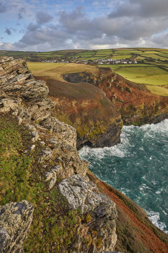 Evening sunlight illuminating cliffs along the Atlantic coast near Boscastle in Cornwall Great Britain