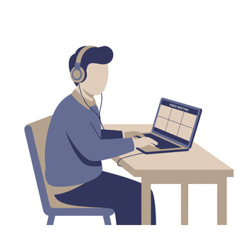 Person Working at Laptop with Headphones.