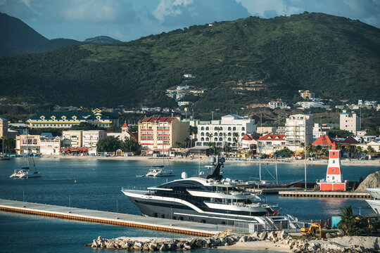 View of Great Bay Beach with promenade and boats in Philipsburg, St Maarten during a sunny day