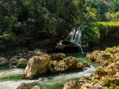 Flowing water at Cahabon River with waterfalls in Guatemala