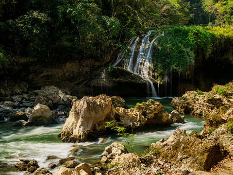 Cahabon River waterfall flows over rocks in Semuc Champey natural monument in Lanquin Alta Verapaz Guatemala