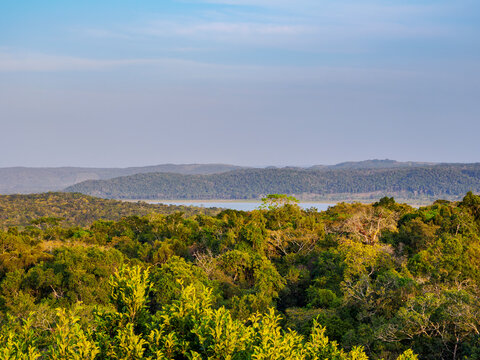 View of Yaxha Lake from Temple 216 at East Acropolis during sunset in Guatemala