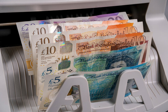 British pound notes in a cash handling machine for exchange