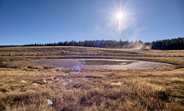View of Deer Lake Sinkhole at sunset on Kaibab Plateau with wooden fence to protect cattle