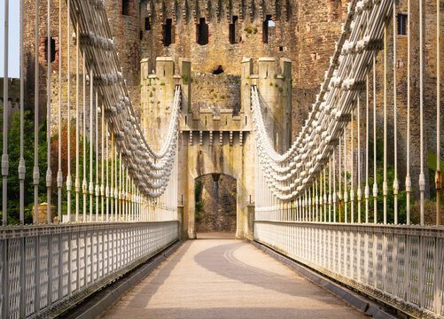 Conwy Suspension Bridge spans the River Conwy leading to historic Conwy Castle in Wales