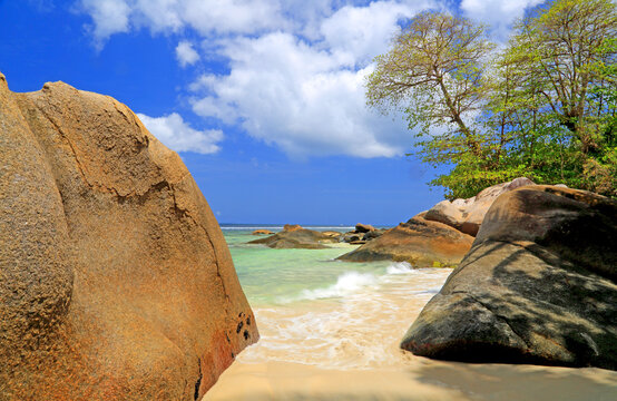 Exploring the sandy shores and clear waters of Beau Vallon Beach in Seychelles during a sunny day