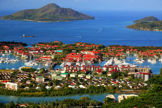 Eden Island view showing boats, buildings, and greenery near the coast in Seychelles during daylight hours