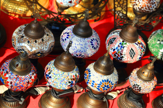 Colorful lamp stall at Dubai Creek showcasing various designs and styles for visitors viewing and purchasing
