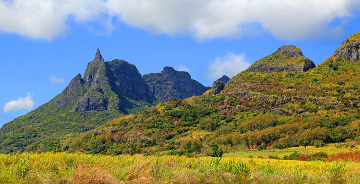 View of Pieter Both mountain in central Mauritius with green hills and blue sky