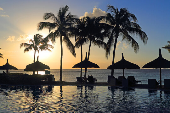 Sunset view from Le Meridien Ile Maurice Resort overlooking the water in Pointe aux Piments, Mauritius at the end of the day