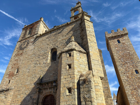 Exploring the structure of the Church of San Mateo in Caceres Spain overlooking the sky and surrounding architecture