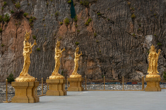 Golden statues of Buddhist female gods located at the Buddha Dordenma in Thimphu, Bhutan highlight cultural heritage and devotion