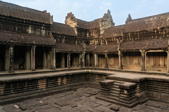 Exploring the ancient architecture of Angkor Wat in Siem Reap Cambodia under clear skies in the morning