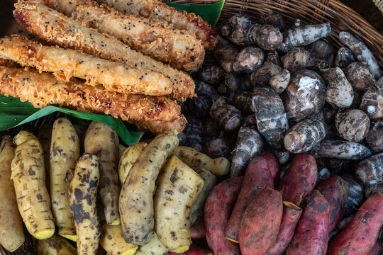 Local market offers various types of roots and snacks in Siem Reap, Cambodia during daytime
