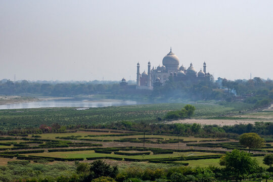 View of Taj Mahal from Agra Fort showcasing the iconic structure surrounded by landscape in Agra, Uttar Pradesh, India