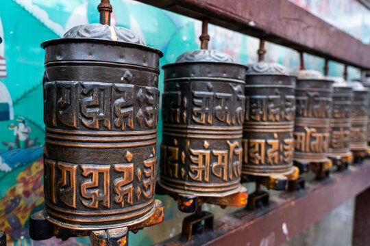 Prayer wheels turn in Boudhanath Stupa, capturing local culture and spiritual activity in Kathmandu