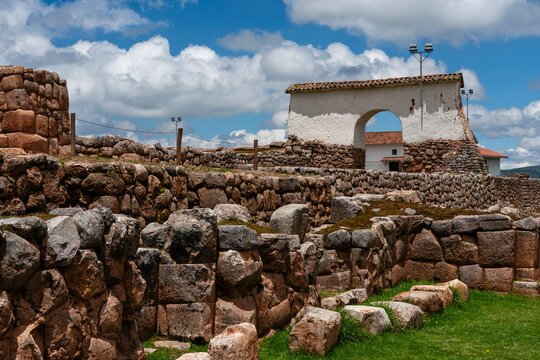 Chinchero archaeological site showcases ancient ruins and historical architecture in Cusco region of Peru under blue skies