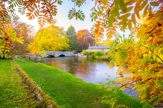 View of Sheepwash Bridge and River Wye surrounded by autumn colors in Bakewell, Derbyshire Dales, United Kingdom