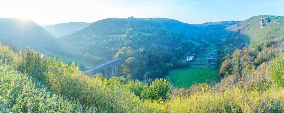 View of Monsal Dale with viaduct at sunset during autumn in Bakewell, Derbyshire Dales, England