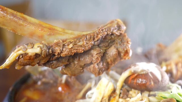 Braised beef short ribs with vegetables in spicy broth
