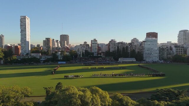 Argentine cavalry army formation on Campo Argentino de Polo, city skyline behind