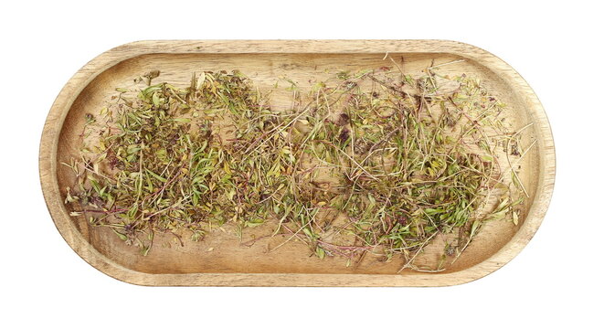 Dried chopped thyme leaves in wooden bowl, isolated on white background, top view
